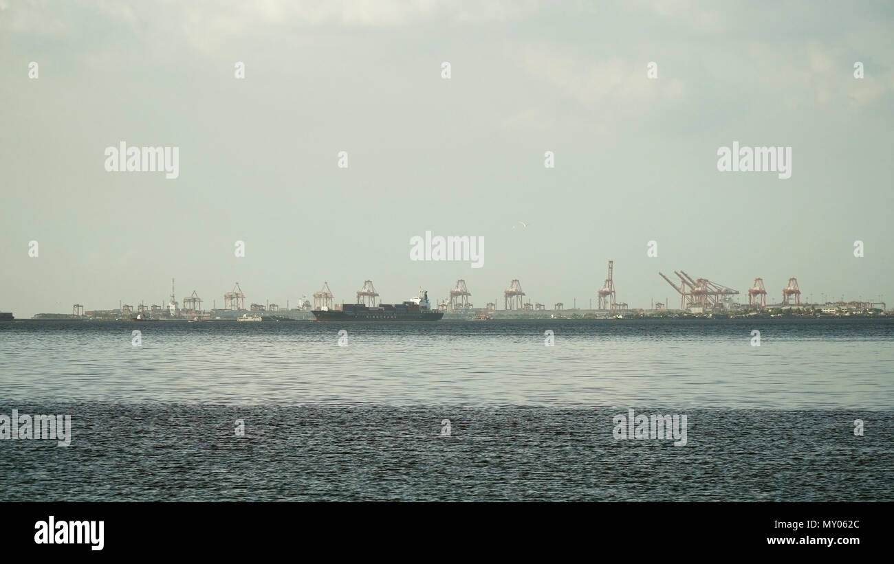 Cargo ship with containers floating on the sea. Cargo ships in the Bay