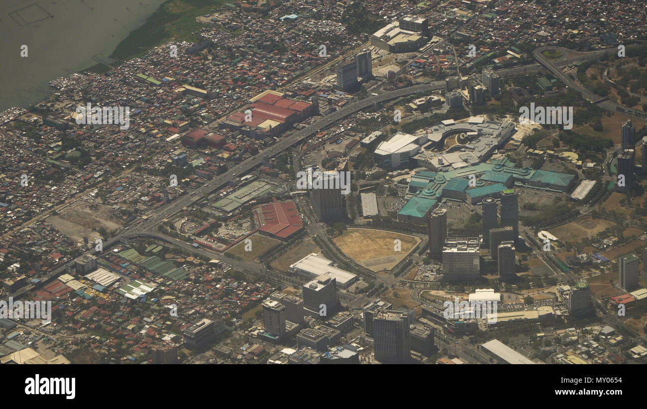 View through an airplane window on the city. Airplane window view