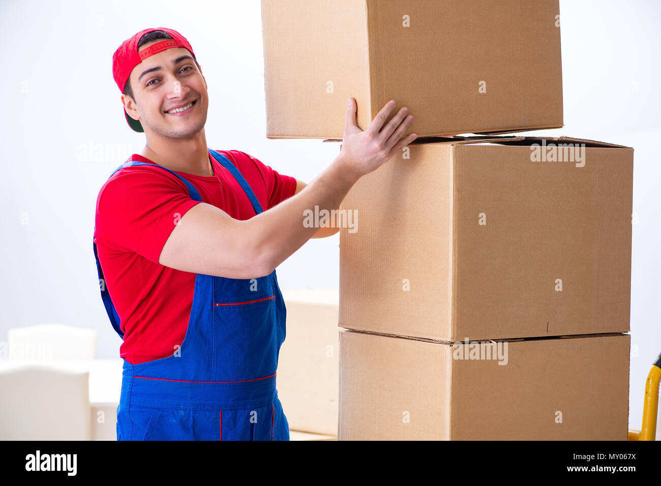 Contractor worker moving boxes during office move Stock Photo - Alamy