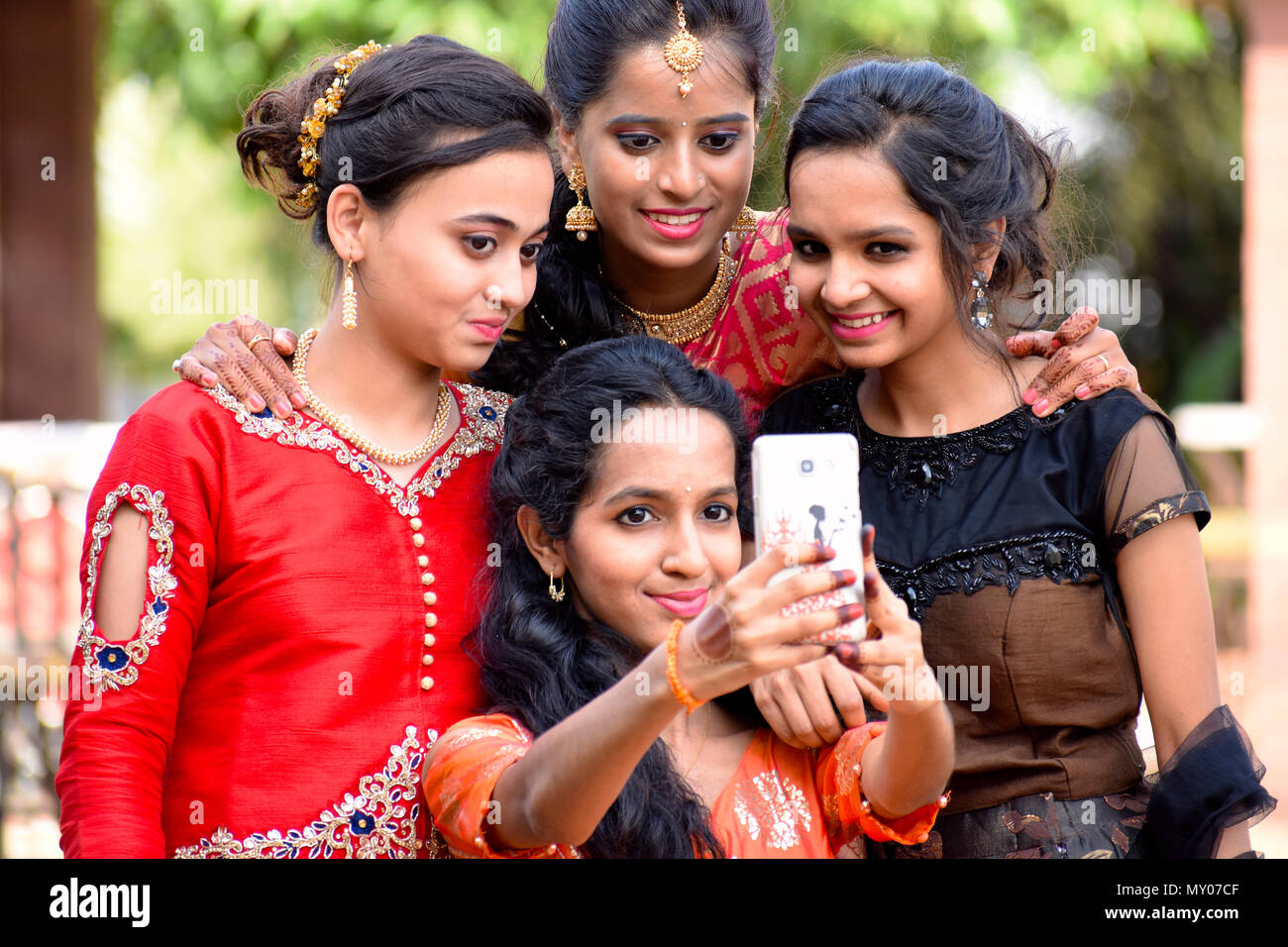 Group Of Well Dressed Girls Taking Selfies On Phone Pune Maharashtra