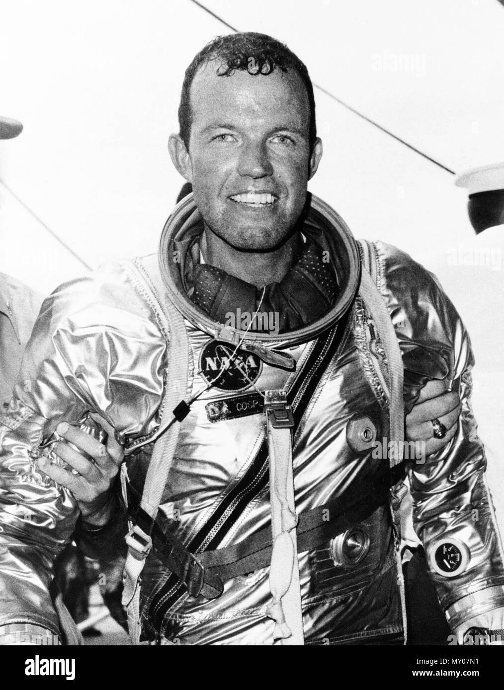 (16 May 1963) --- Astronaut L. Gordon Cooper Jr., pilot of the Mercury-Atlas 9 (MA-9) mission after climbing out of his spacecraft Faith 7 after a 600,000-mile journey. Stock Photo