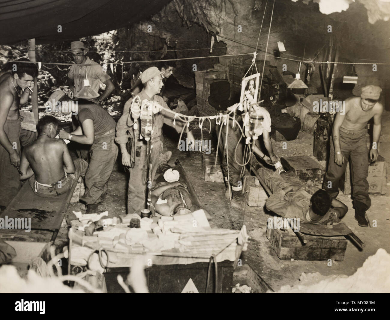 Wounded of first marine division on Okinawa at collection point being given blood and plasma Stock Photo