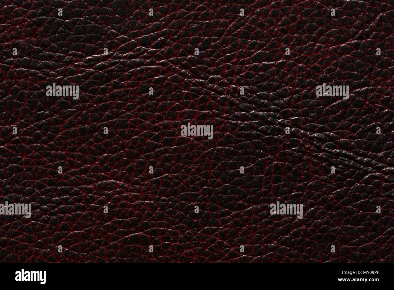 Extraordinary leather texture in dark black red tones. Stock Photo