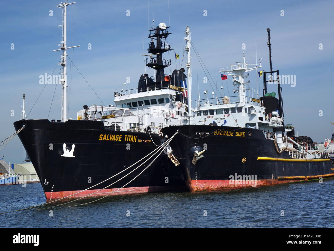 KAOHSIUNG, TAIWAN -- MAY 26, 2018: Two large ocean-going tugs are anchored in the busy port of Kaohsiung, a major trading hub for Taiwan. Stock Photo