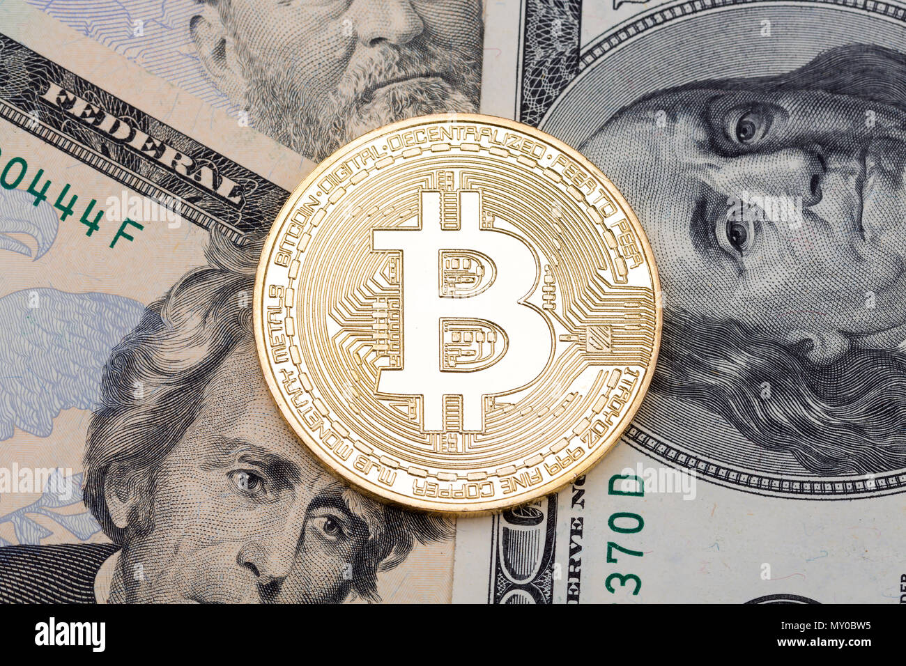 Golden coin bitcoin and dollars on laptop on the table of wealthy crypto  trader. Rich investor with large amount of cash dollars and golden bitcoin  co Stock Photo - Alamy