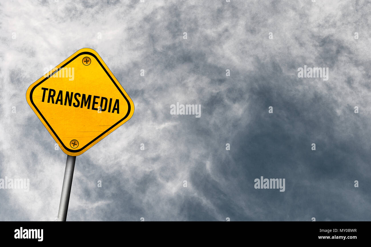 Transmedia - yellow sign with cloudy sky Stock Photo