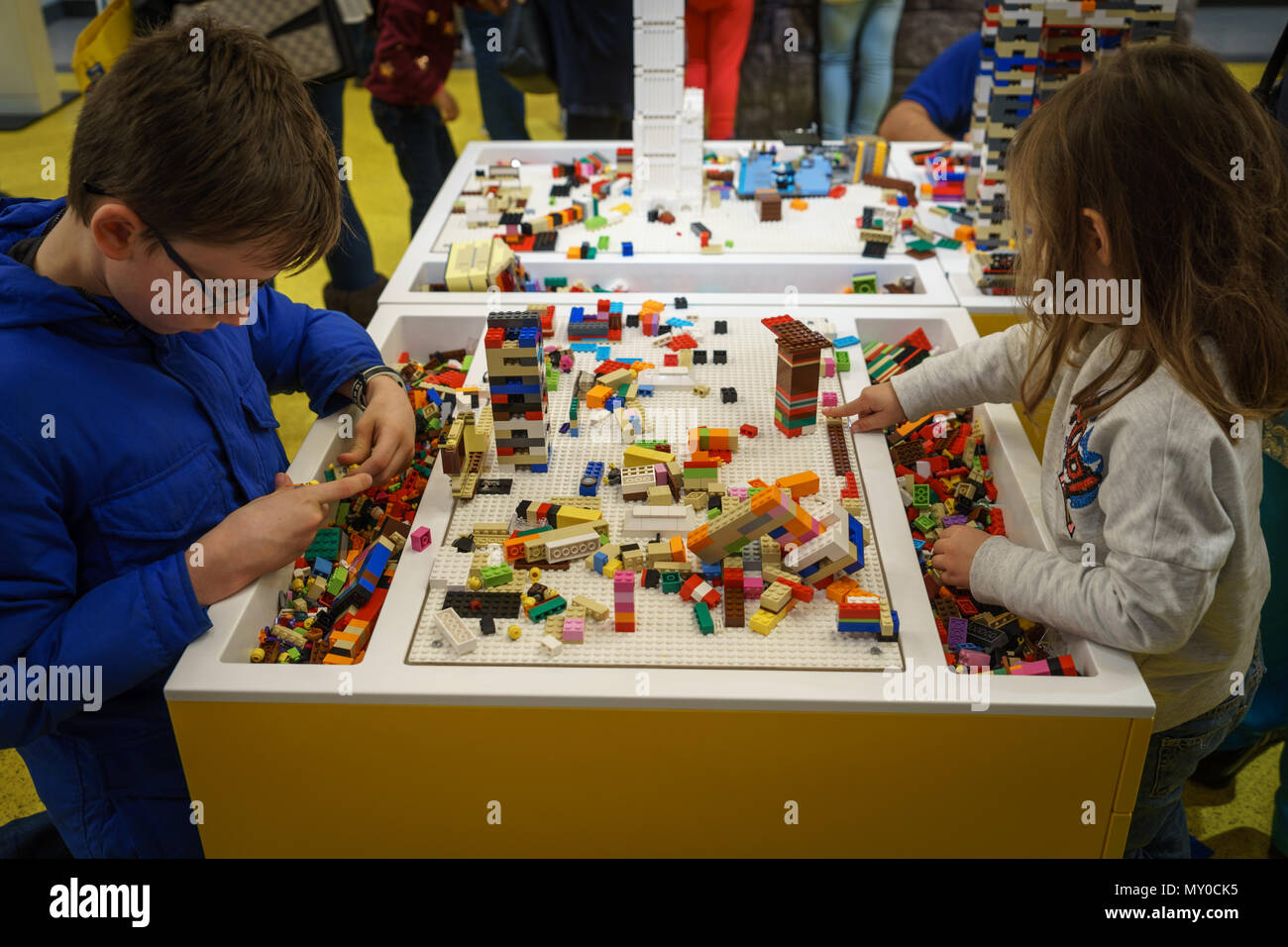 London, UK - November 2017. Kids playing with blocks in the Lego Store in Leicester Square. Landscape format. Stock Photo