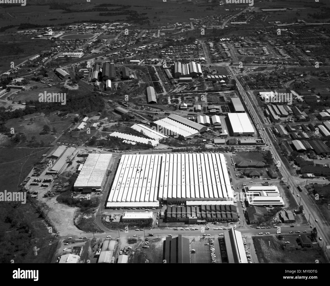 Rocklea Industrial Area, April 1965. The Courier-Mail 8 April 1954  INDUSTRIAL SITES DEMAND. Southern firms set up offices and factories (  )   A BIG demand for industrial sites in and around Brisbane has been made in recent weeks by large southern industries and manufacturing firms.  Sydney and Melbourne firms which formerly had only a representative in Brisbane are now setting up branch offices, storage rooms, and, in some cases, factories. Real estate agents reported yesterday that already several sales of small sites had been made, while other firms had placed orders for suitable sites.  M Stock Photo