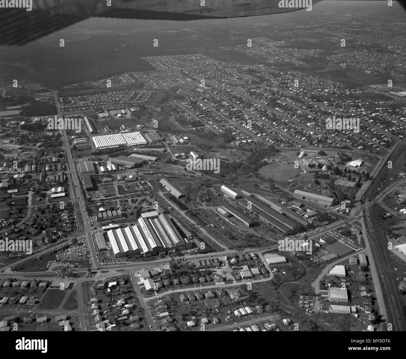 Rocklea Industrial Area, Brisbane, 1967. The Courier-Mail 8 April 1954  INDUSTRIAL SITES DEMAND. Southern firms set up offices and factories (  )   A BIG demand for industrial sites in and around Brisbane has been made in recent weeks by large southern industries and manufacturing firms.  Sydney and Melbourne firms which formerly had only a representative in Brisbane are now setting up branch offices, storage rooms, and, in some cases, factories. Real estate agents reported yesterday that already several sales of small sites had been made, while other firms had placed orders for suitable sites Stock Photo