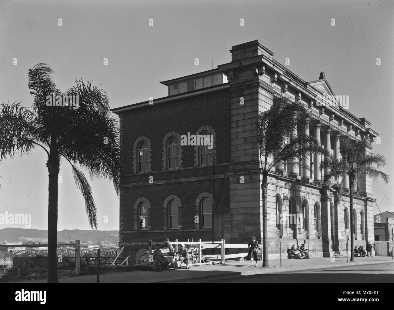 State Library Building, Brisbane, c 1957. From the Queensland Heritage Registerid=600177 ) .  This building was constructed in two stages. The three-storeyed William Street section was erected by the colonial Queensland Government between 1876 and 1879, as the first purpose-built home for the Queensland Museum, which had been established in 1855. The four-storeyed extension was erected in 1958-59 as the Queensland Government's major centennial project.  In 1876 the design for the first section was completed under the supervision of colonial architect FDG Stanley, and a construction contract fo Stock Photo