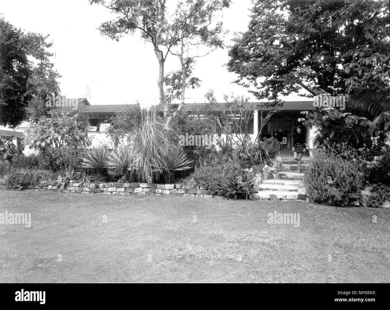State Migration Office, Yungaba, Kangaroo Point, August 1971. From the Queensland Heritage Registerid=600245 ) .  Yungaba is a two-storey brick institutional building designed as an immigrant depot in 1885 by John James Clark, colonial architect for Queensland. Following his dismissal shortly after, the plan was developed by Edward Henry Alder and Robert Henry Mills. Constructed by William Peter Clark, the building is described as being of Italianate/Queensland/ Institutional style.  Following the subdivision of Kangaroo Point in 1843-44, lots 21 and 22 were purchased by Judah and Isaac Solomo Stock Photo
