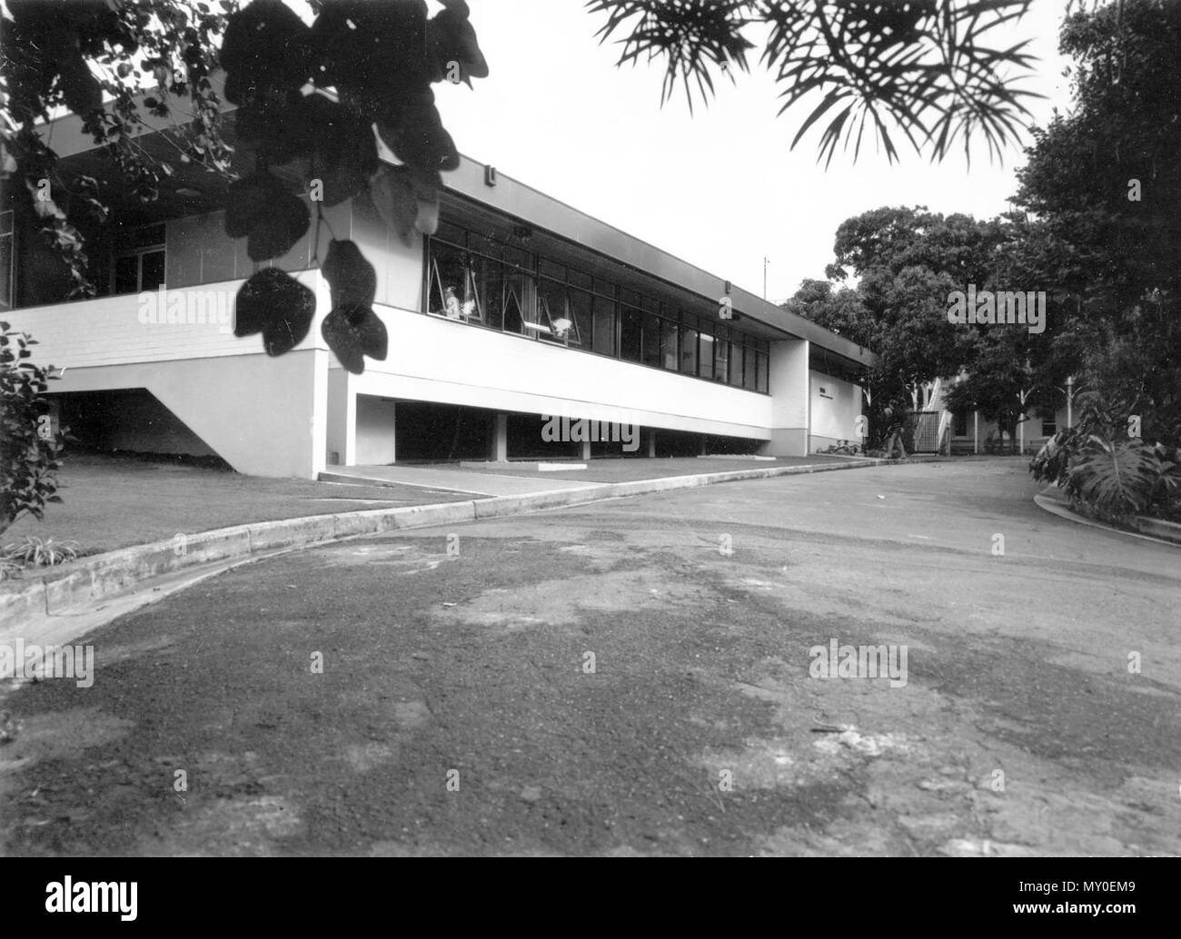 State Migration Office, Yungaba, Kangaroo Point, August 1971. From the Queensland Heritage Registerid=600245 ) .  Yungaba is a two-storey brick institutional building designed as an immigrant depot in 1885 by John James Clark, colonial architect for Queensland. Following his dismissal shortly after, the plan was developed by Edward Henry Alder and Robert Henry Mills. Constructed by William Peter Clark, the building is described as being of Italianate/Queensland/ Institutional style.  Following the subdivision of Kangaroo Point in 1843-44, lots 21 and 22 were purchased by Judah and Isaac Solomo Stock Photo
