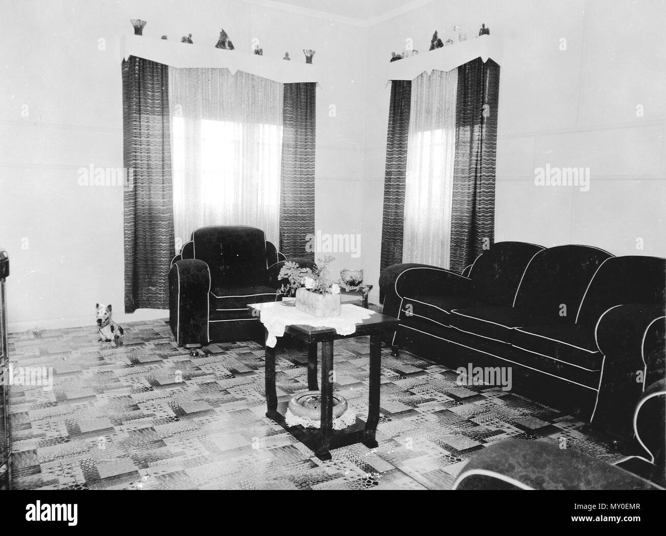 State rental house interior, Serviceton, c 1953. The tiny township of Serviceton was selected in 1946 by the Serviceton Co-operative Society for development to help meet the shortage of post-war housing. The Society purchased 850 acres of land which was taken over by the Queensland Housing Commission in 1950, to which it added another 200 acres. The area was renamed Inala in 1953 to avoid confusion with the town of Serviceton in South Australia.  Inala was planned as a satellite town of Brisbane and houses were largely Modernist Revival style with elements of Art Deco. Stock Photo