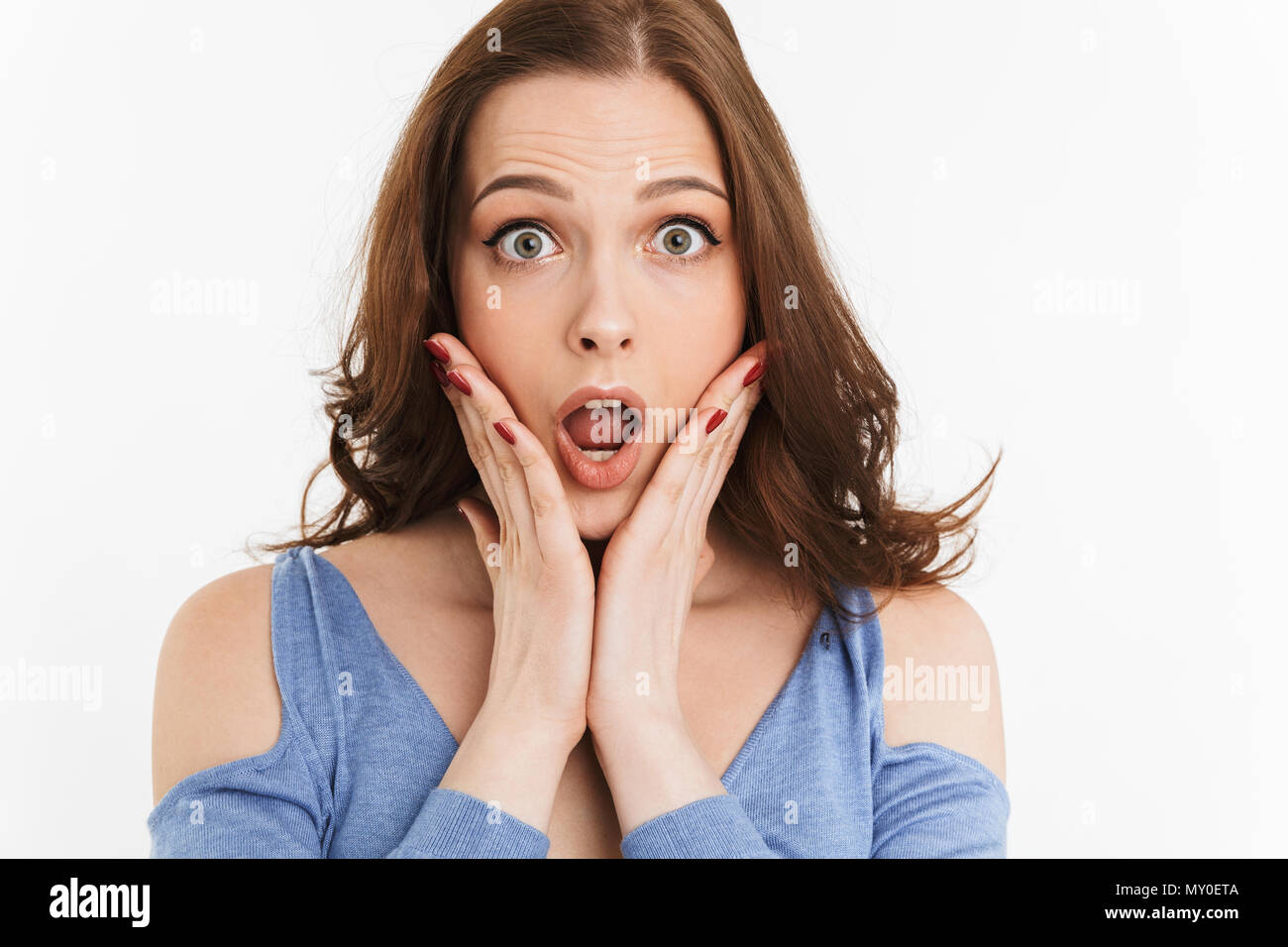 Close Up Portrait Of A Surprised Young Woman Screaming Isolated Over White Background Stock