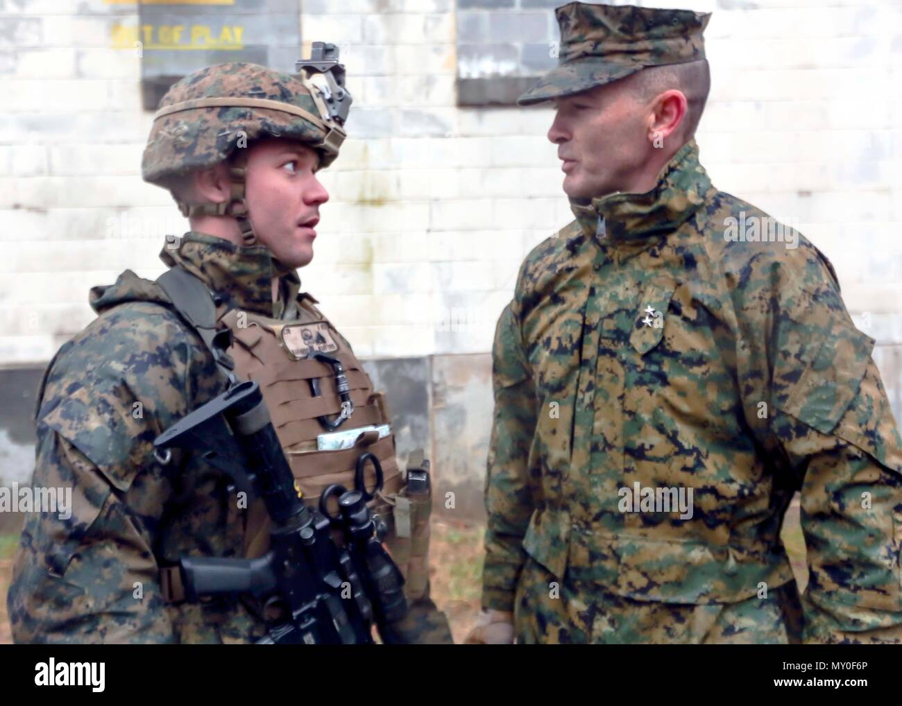 Major Gen. John K. Love congratulates Cpl. Zachary A. Warford on winning Marine of the Quarter for 2nd Marine Division during a deployment for training exercise at Fort Pickett, Va., Dec. 6, 2016. The Marines conducted a two-week DFT in preparation for their upcoming unit deployment program. Love is the Commanding General for 2nd Marine Division and Warford is a team leader with Lima Company, 3rd Battalion, 8th Marine Regiment. (U.S. Marine Corps photo by Sgt. Clemente C. Garcia) Stock Photo
