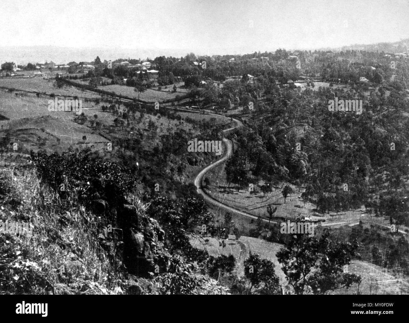Toll Bar Road, Brisbane to Toowoomba, c 1934. ATTEMPTED HOLD-UP. 173324969?searchTerm=toll bar road toowoomba&amp;searchLimits=l-state=Queensland|||l-word=100+-+1000+Words )   ON TOLL BAR ROAD.  TOOWOOMBA SENSATION.  TOOWOOMBA, Nov. 30. - After barricading the Toll Bar-road at one of its steepest sections a masked man attempted to hold up the driver of a motor-truck last night, but the driver of the truck accelerated and escaped.  According to the police report, Stanley Poore was driving a truck down the Toll Bar-raod about 9.15 p.m. When taking a bend Poore saw a number of saplings and rails  Stock Photo