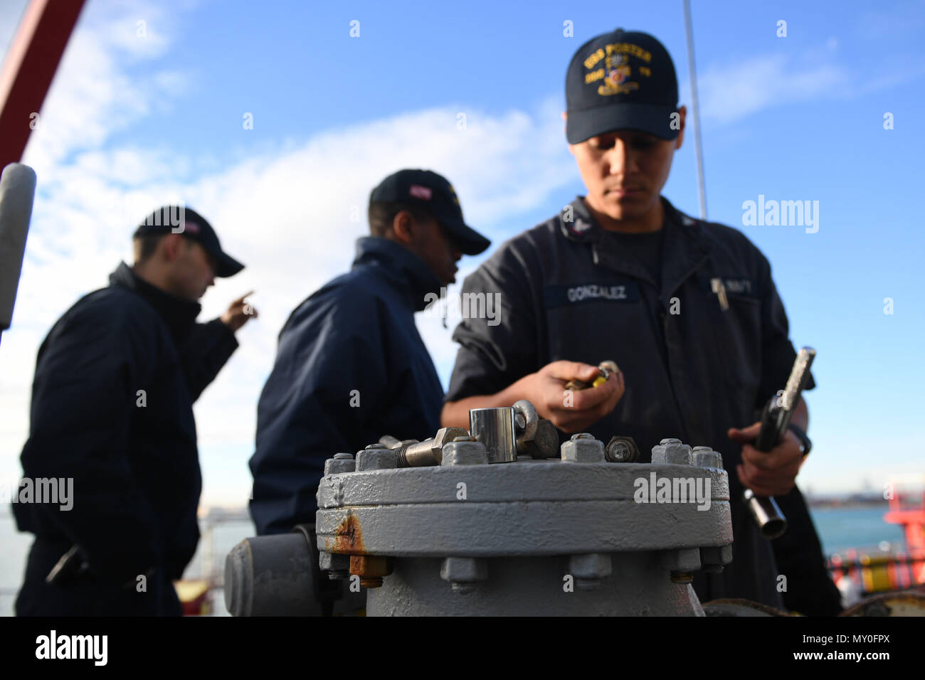 161219-N-JI086-022 - VALENCIA, Spain (Dec. 20, 2016) Petty Officer 3rd Class Enrique Gonzalez, from San Bernardino, Calif., checks his tools aboard the guided-missile destroyer USS Porter (DDG 78) as the ship prepares to take on fuel pier-side in Valencia, Spain, Dec. 20, 2016. Porter, forward-deployed to Rota, Spain, is conducting naval operations in the U.S. 6th Fleet area of operations in support of U.S. national security interests in Europe. (U.S. Navy photo by Seaman Ford Williams/Released) Stock Photo