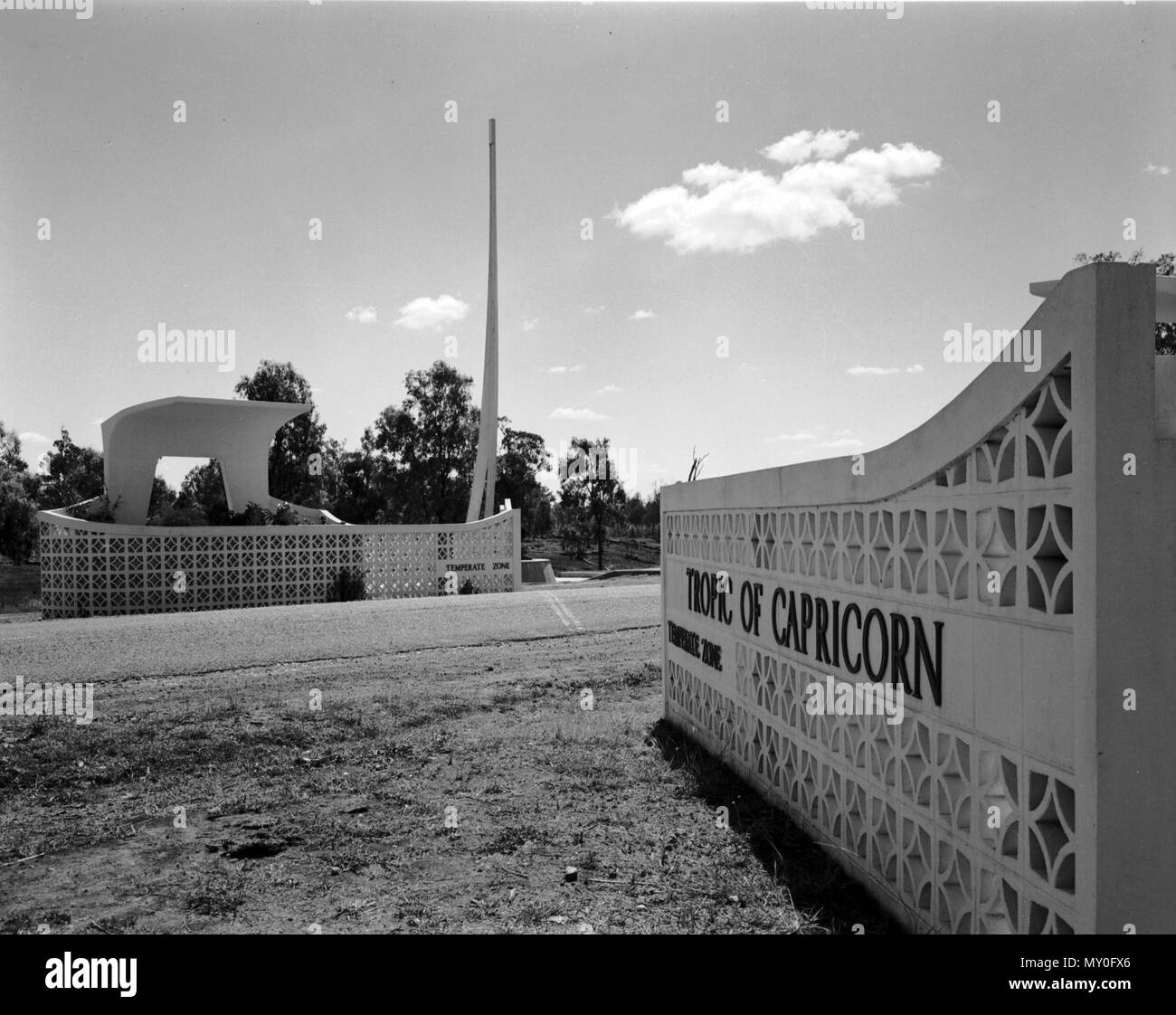 Tropic of Capricorn Marker, Rockhampton, c 1965. The Tropic of Capricorn Marker, commonly known as The Spire, at its original site. The spire was relocated during the deviation of the Bruce Highway in 1980, although the arches and parts of the lattice walls remain on Port Curtis Rd Stock Photo