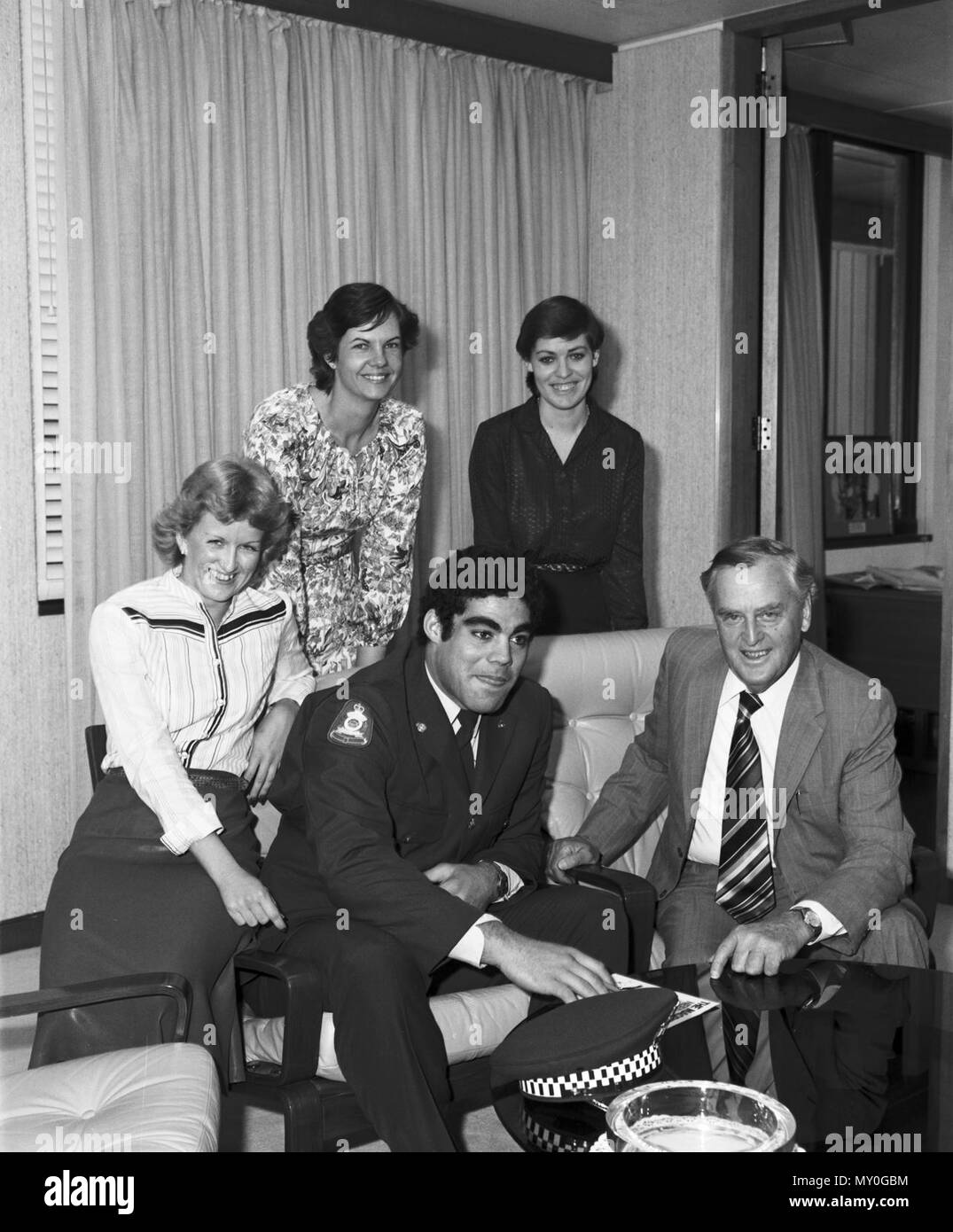 Visit to the office of Premier Joh Bjelke-Petersen by Constable. Before becoming a full-time professional footballer, Mal Meninga was a police officer. At one stage of his police career he was based at West End Police Station along with fellow Souths Magpies players Gary Grienke, Phil Veivers, Gary Belcher and Peter Jackson. Stock Photo