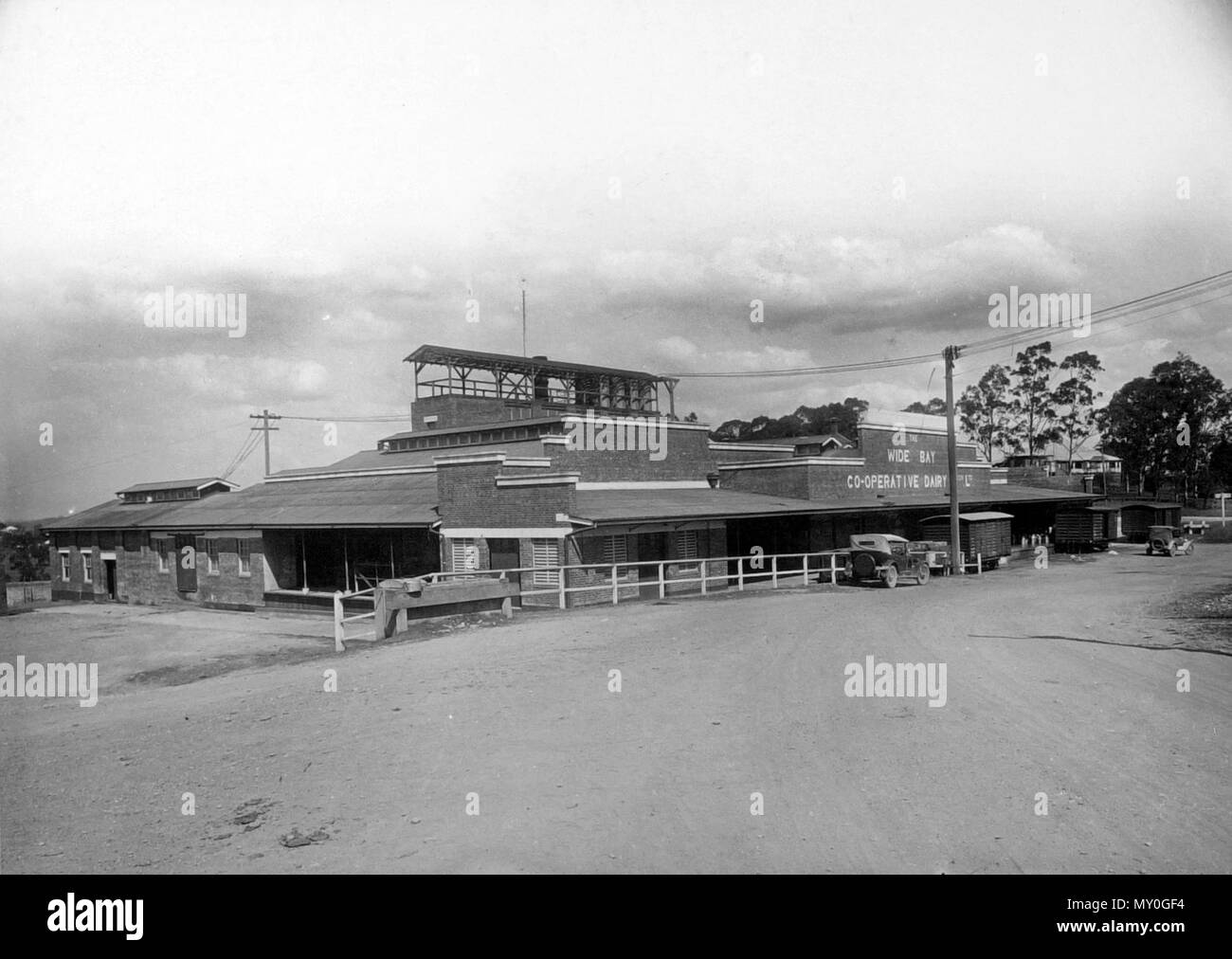 Wide Bay Co-operative Dairy Association factory, Gympie, 1929. The Brisbane Courier 16 March 1929  WIDE BAY CO-OPERATIVE DAIRY ASSOCIATION. 21386374 )   During February the Wide Bay Co-operative Dalry Association manufactured 732,5251b. of butter (327 tons 0 cwt. lqr. 171b.), for which suppliers were paid £49,918/18/4, being at the rate of l/4½ per lb, c.b.f. for first class, and l/3½ per lb. for second class quality. The Gympie factory manufactured 593,3271b, and paid to suppliers £40,444/13/2. The Cooroy factory turned out 139,1981b., for which suppliers were paid £9477/5/2. Stock Photo