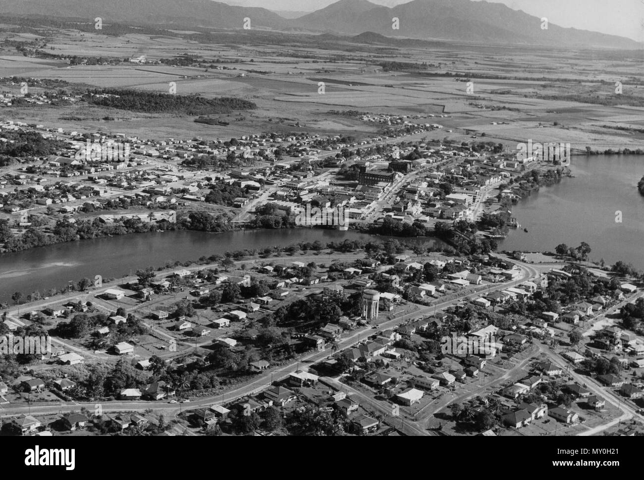 Aerial view of Innisfail, c 1946. The Evening Advocate 27 May 1946  Innisfail May Have Air Feeder Planes 212281075 )   Notice that Innisfail is to be included in the Australian National Airways service in the future was received at Thursday's monthly meeting of the Johnstone Shire Council.  The Chairman, Cr. C. J. Duffin, remarked It is pleasing to see that Innisfail has not been forgotten and that we still may get some recognition. Stock Photo