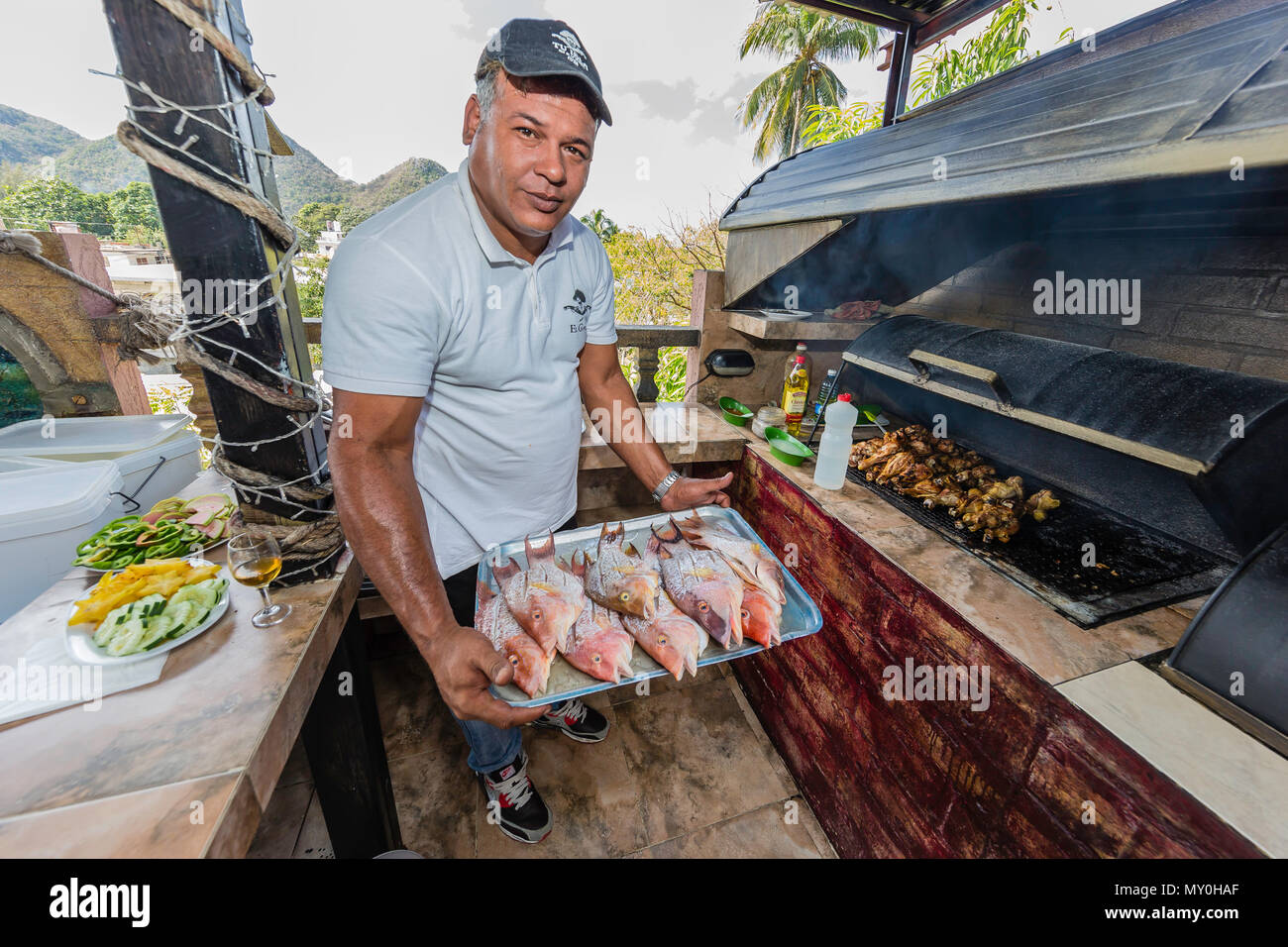 Fresh caught fish being prepared at a private restaurant in Nueva Gerona on Isla de la Juventud, Cuba Stock Photo