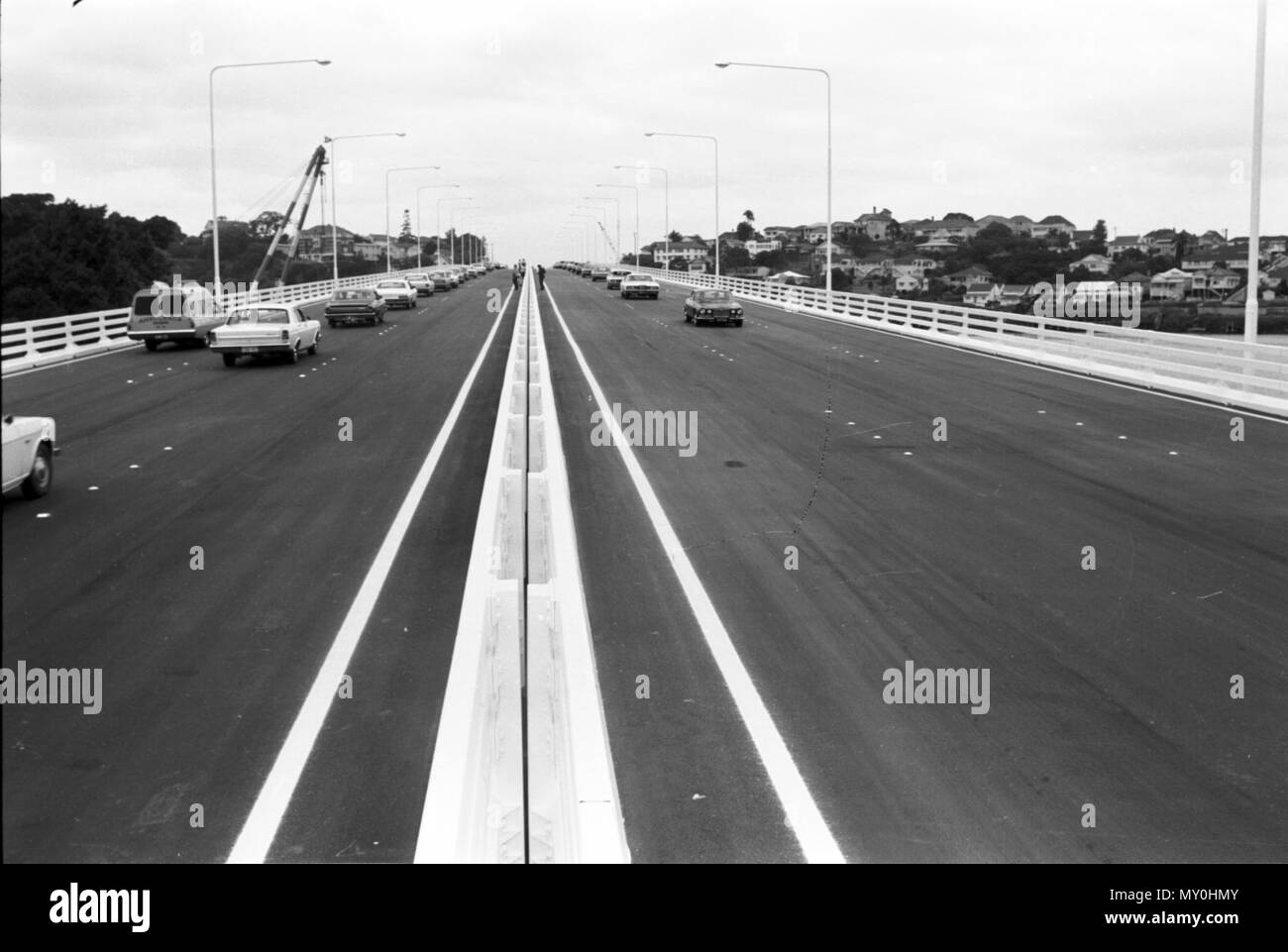 First public traffic on the Captain Cook Bridge, Brisbane, 13. Construction of the Captain Cook Bridge commenced in 1968 and was completed in 1972. The main span of 183 metres was the precast prestressed concrete free-cantilever bridge for 3 months until it was overtaken by the Harada Bridge in Japan. Stock Photo