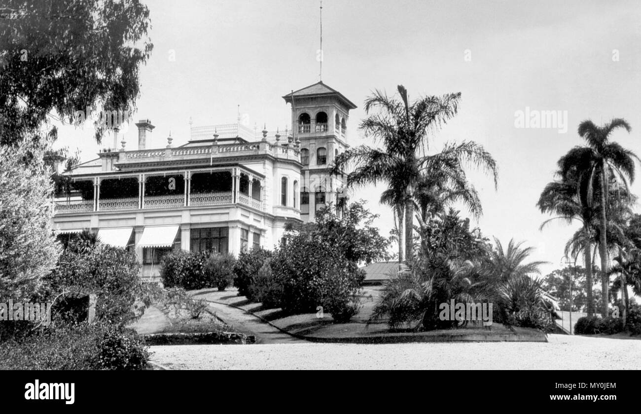 Government House, Fernberg Road, Paddington, Brisbane, c 1930. Johann Heussler, a wealthy Brisbane merchant purchases 22 acres of land from the Government in 1862 and made plans to build a house there. Local architect Benjamin Backhouse designed a house in 1865, to be constructed from stone excavated on site combined with a cement and lime mixture.  The Heussler family lived at Fernberg from 1865 until 1872 when the high cost of upkeep forces foreclosure on the property by the mortgagee.  Sir Arthur Palmer, Premier of Queensland (1870-1874), and later Lieutenant Governor resided in Fernberg fr Stock Photo