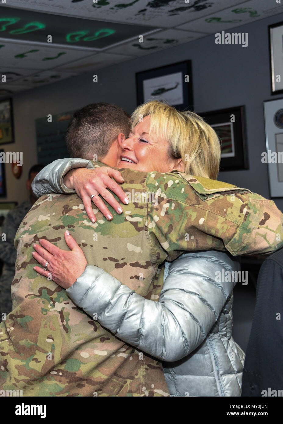 Ronda Ramsier hugs Tech Sgt. Matthew Champagne, U.S. Air Force ...