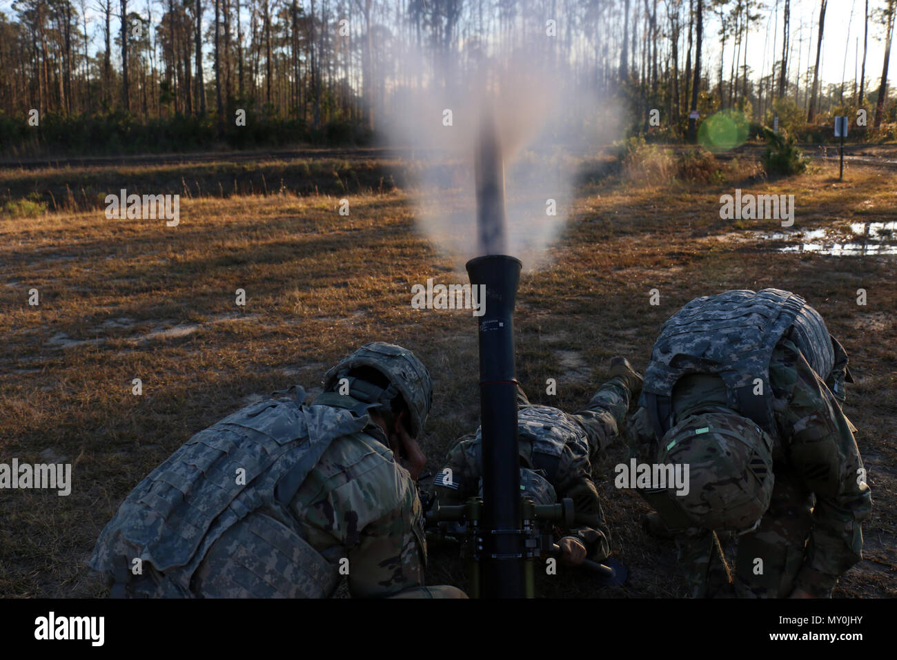 Indirect fire infantrymen with 3rd Battalion, 7th Infantry Regiment, 2nd Infantry Brigade Combat Team, 3rd Infantry Division, fire an 88mm mortar round during a combined arms live-fire exercise (CALFX) at Fort Stewart, Ga., December 15, 2016. The CALFX brought together infantrymen, engineers, artillerymen and air support assets to certify the Bravo 13 range complex. Bravo 13 is a newly configured light infantry range designed for company live fire exercises at Fort Stewart. (U.S Army photo by Spc. Efren Rodriguez/Released) Stock Photo