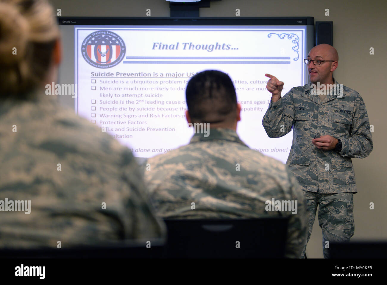 Capt. Adam Dell, 81st Medical Operations Squadron Mental Health Clinic element chief, gives a briefing on effective communication and mental health, Dec. 12, 2016, on Keesler Air Force Base, Miss. As a new addition to the course’s four-week structure, mental health professionals discussed ways to properly engage and seek help for Airmen exhibiting suicidal warning signs. (U.S. Air Force photo by Senior Airman Duncan McElroy) Stock Photo