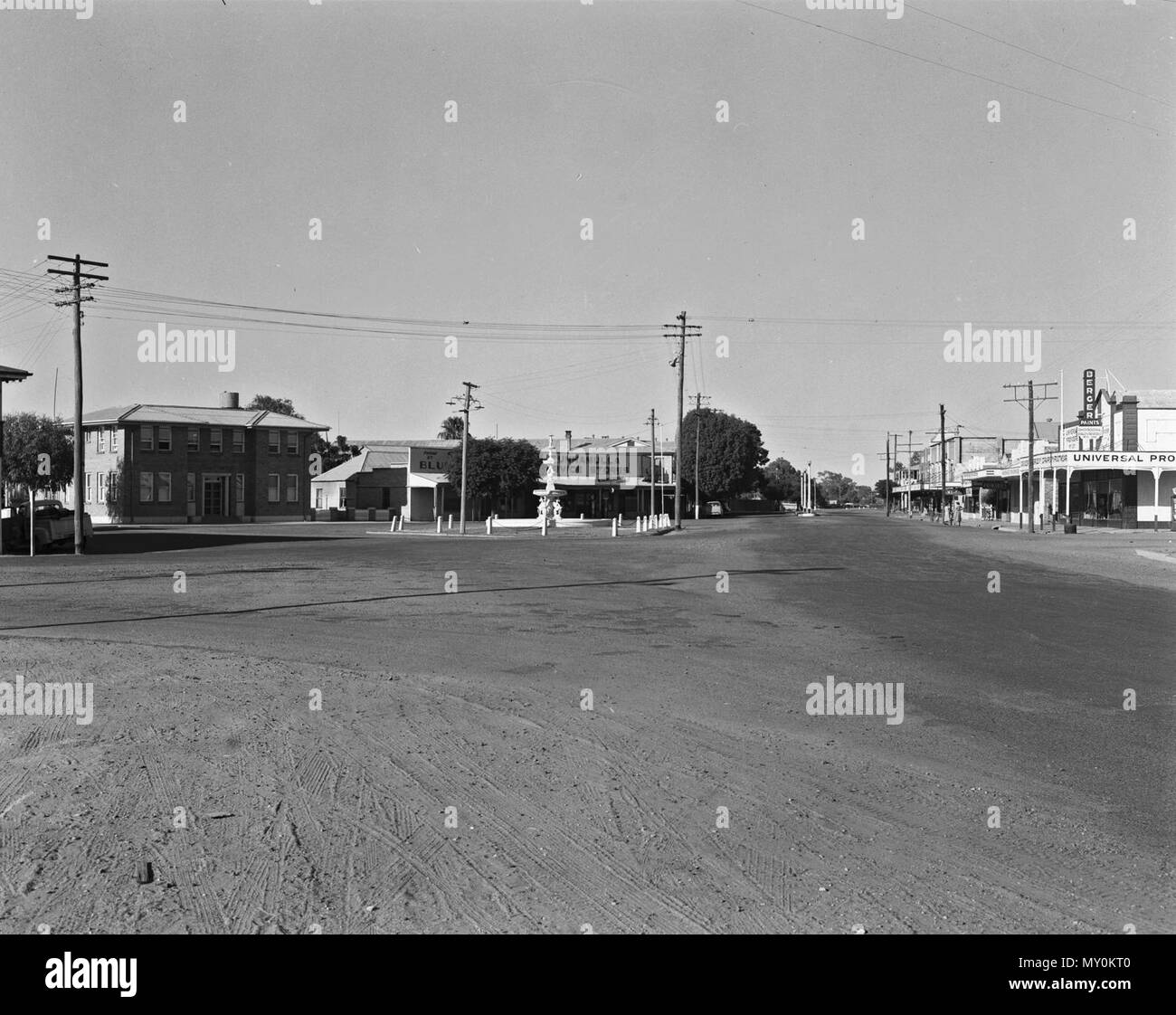 Jane Street, Cunnamulla, c 1955. Cunnamulla means long stretch of water and the town was founded at the intersection of two major stock routes which needed a reliable water supply. It became a coach stop for Cobb and Co coaches and the town was formally surveyed in 1868. Stock Photo