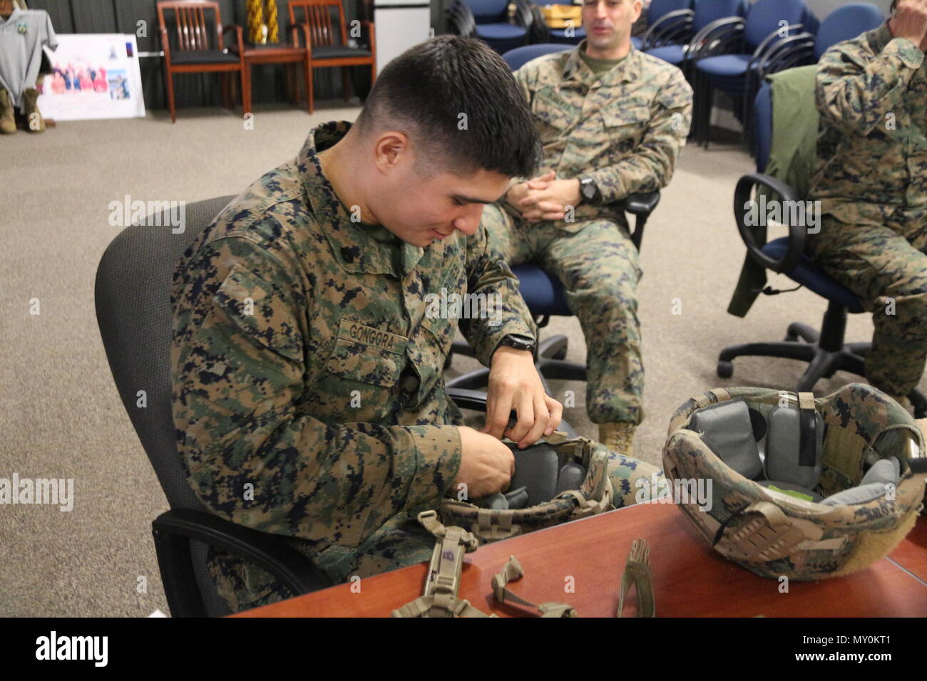 Staff Sgt. Aldo Gongora with School of Infantry–East from Camp Lejeune, N.C., evaluates a helmet retention system during an Infantry Equipping Challenge limited user evaluation in December aboard Marine Corps Base Quantico, Va. The Infantry Equipping Challenge is an ongoing effort at Marine Corps Systems Command to leverage new and emerging technologies from industry to enhance the capability of Infantry Marines. (U.S. Marine Corps photo by Ashley Calingo) Stock Photo