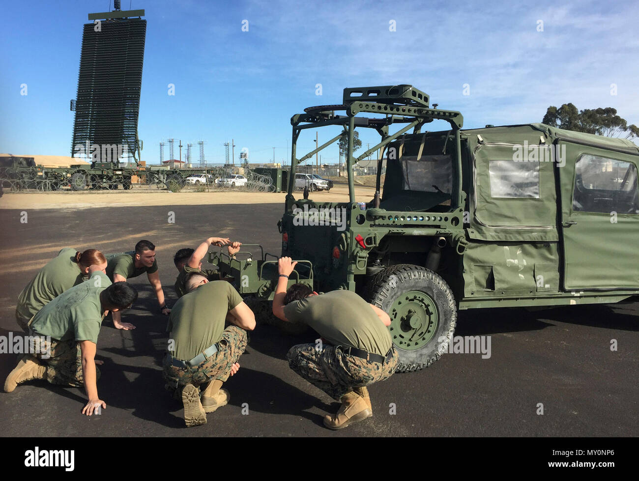 Marine Corps Air Station Miramar, California – The Marines attached to the Marine Air Control Group detachment of the 15th Marine Expeditionary Unit asses how to build an all-weather case for the Tactical Air Control Element to house it on an ITV.  The TACE is a mobile and digitally interoperable tactical air support, air defense and air traffic control service, which is an emerging concept of a scalable aviation command and control element for MEU commanders and internally transportable via organic MEU assets. Stock Photo