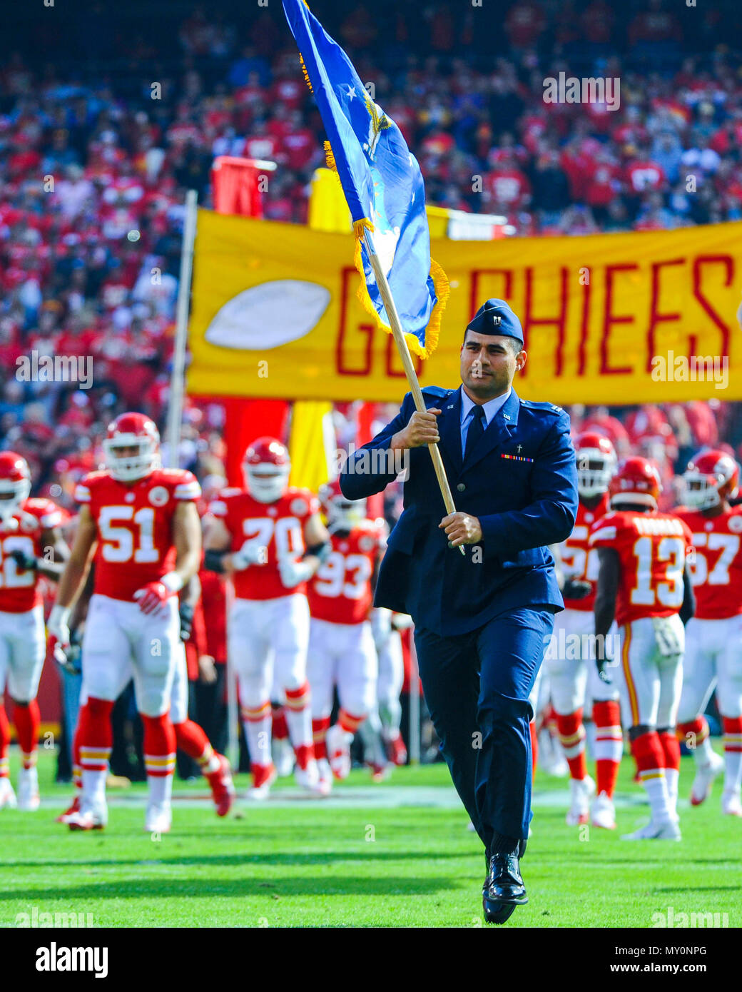 Capt. Fabian Tafuna, 22nd Air Refueling Wing chaplain, carries the Air  Force flag before at a Kansas City Chiefs football game in honor of  Veteran's Day Nov. 6, 2016, Arrowhead Stadium, Mo.