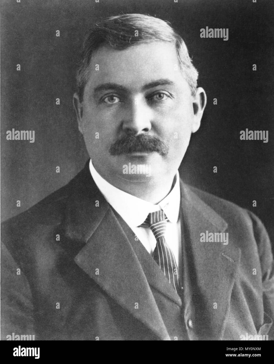 Portrait of The Honourable Thomas Joseph Ryan, Premier of Queensland. Thomas Joseph Ryan (1 July 1876 - 1 August 1921) was Premier of Queensland from May 1915 until October 1919 when he resigned to enter Federal politics.  The Ryan government was the first majority Australian Labor Party government of Queensland as a result of the 1915 election. Some of the eight members of his Cabinet had connections with the early ALP of the 1880s and the Shearer's Strike.  His government would provide the example which would see Labor in power in Queensland almost continuously until 1957. Major reform of La Stock Photo