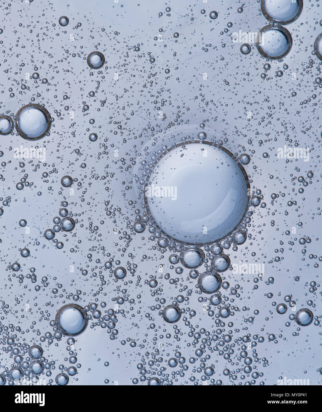 Full frame of the textures formed by the bubbles and drops of oil in ...