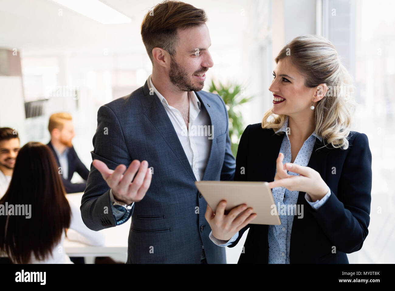 Young attractive architects using digital tablet in office Stock Photo