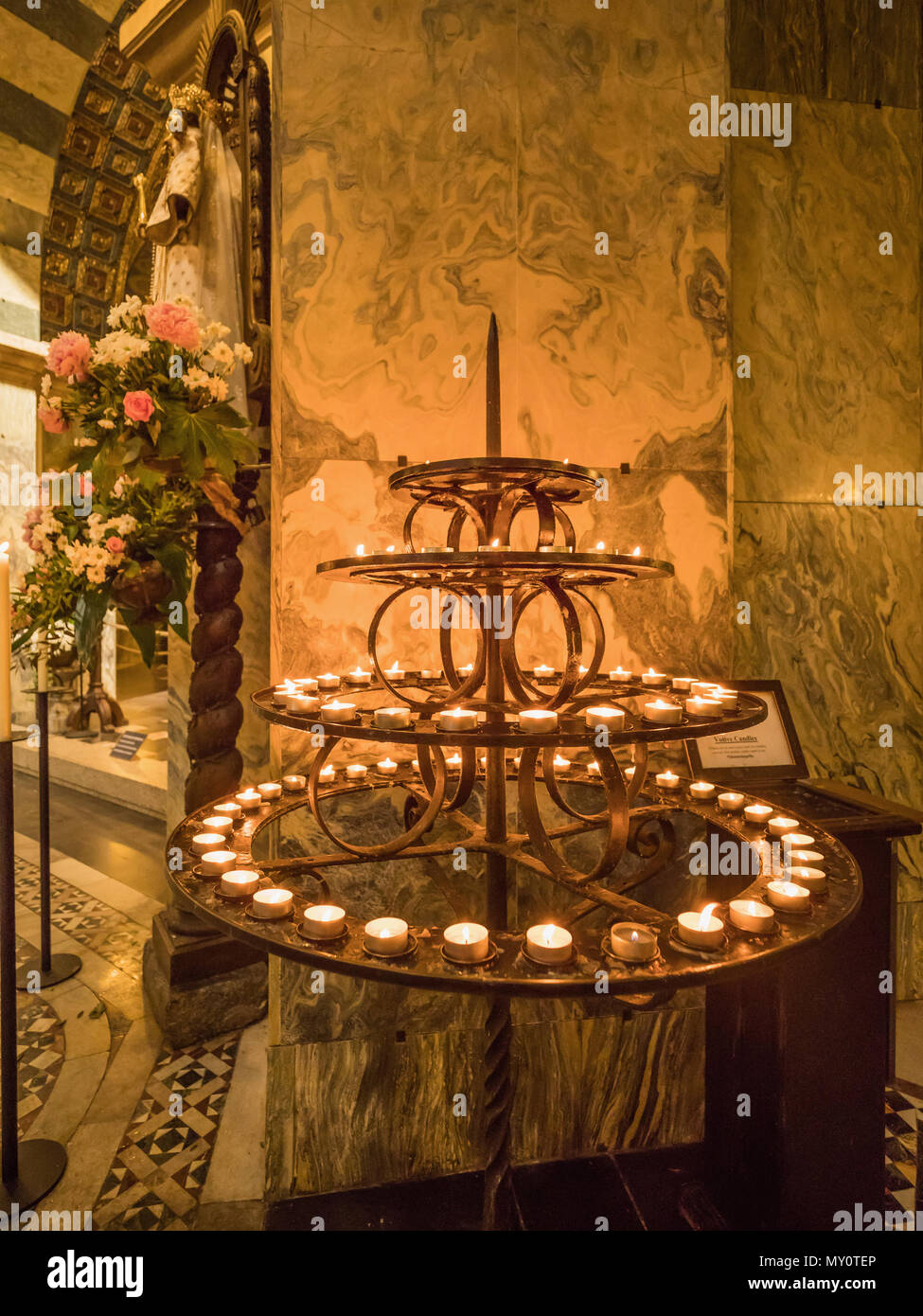 Candle on the bowl in Carolingian Octagon (Palatine chapel) in Aachen Cathedral, Germany. Stock Photo