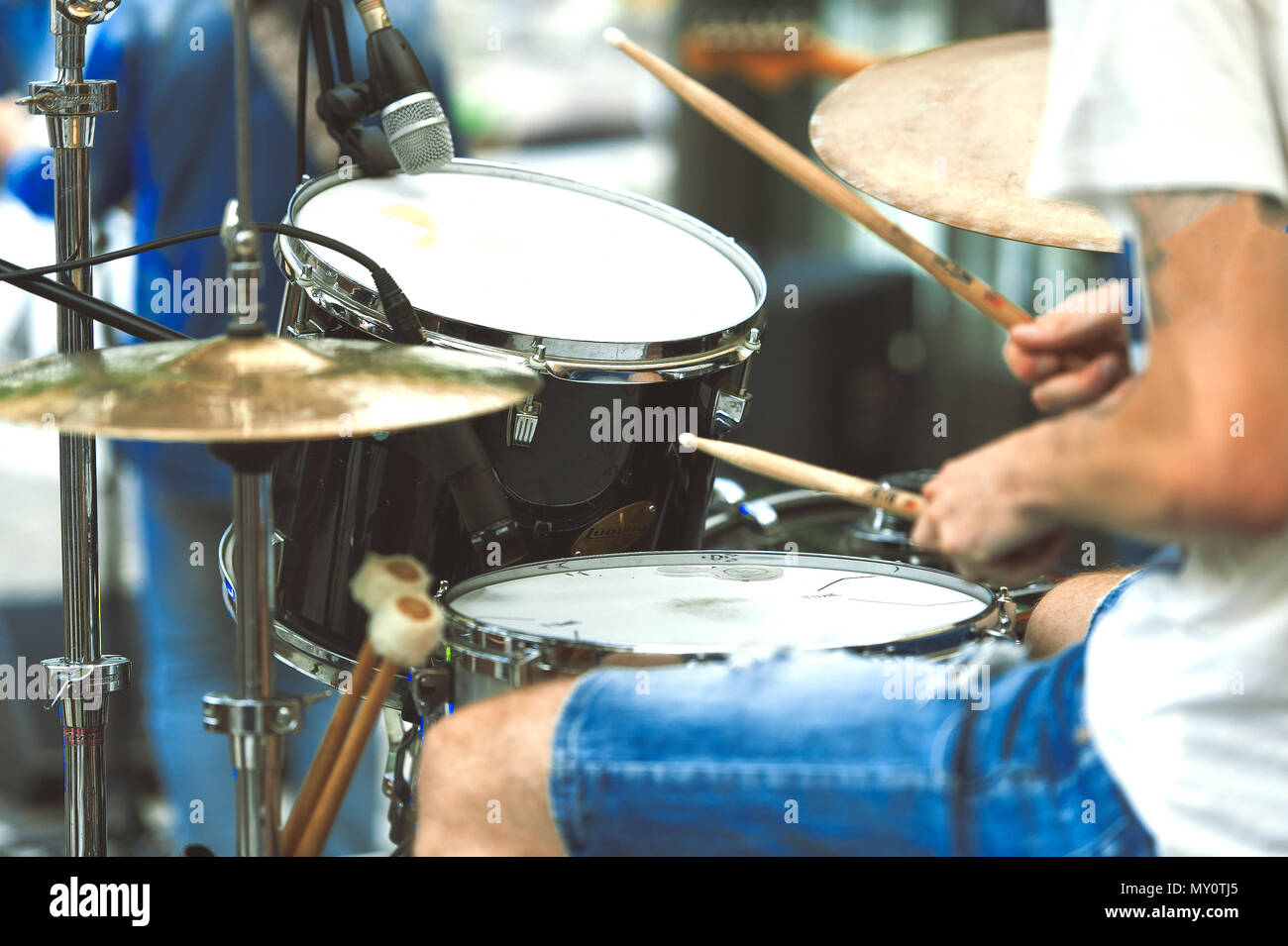 Drummer detail of a pop group during a show. Stock Photo