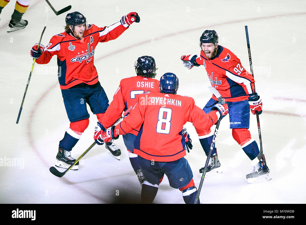 Washington DC, USA. 4th June, 2018. Washington Capitals center Nicklas Backstrom (19), center Evgeny Kuznetsov (92) and left wing Alex Ovechkin (8) converge to congratulate right wing T.J. Oshie (77) after his first period goal against the Vegas Golden Knights on June 4, 2018, at the Capital One Arena in Washington, DC in Game 4 of the Stanley Cup Playoffs. Credit: Action Plus Sports Images/Alamy Live News Stock Photo