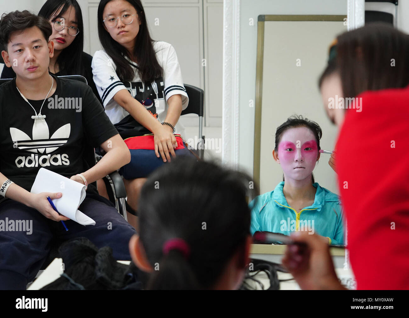 Xi'an, China's Shaanxi Province. 5th June, 2018. Students take a Peking Opera makeup class at Northwestern Polytechnical University in Xi'an, capital of northwest China's Shaanxi Province, June 5, 2018. The university started running courses of Peking Opera in September last year to promote traditional opera among students. Peking Opera, listed by UNESCO as an intangible cultural heritage, is the most famous among hundreds of forms of local opera in China. Credit: Shao Rui/Xinhua/Alamy Live News Stock Photo