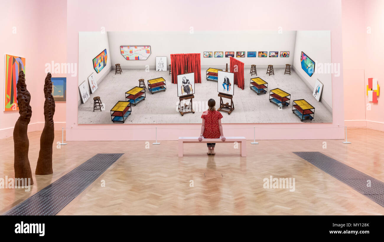 London, UK.  5 June 2018.  A staff member views 'Seven Trollies, Six and a Half Stools, Six Portraits, Eleven Paintings and Two Curtains' by David Hockney RA at the preview of the 250th Summer Exhibition at the Royal Academy of Arts in Piccadilly, which has been co-ordinated by Grayson Perry RA this year.  Running concurrently, is The Great Spectacle, featuring highlights from the past 250 years.  Both shows run 12 June to 19 August 2018. Credit: Stephen Chung / Alamy Live News Stock Photo