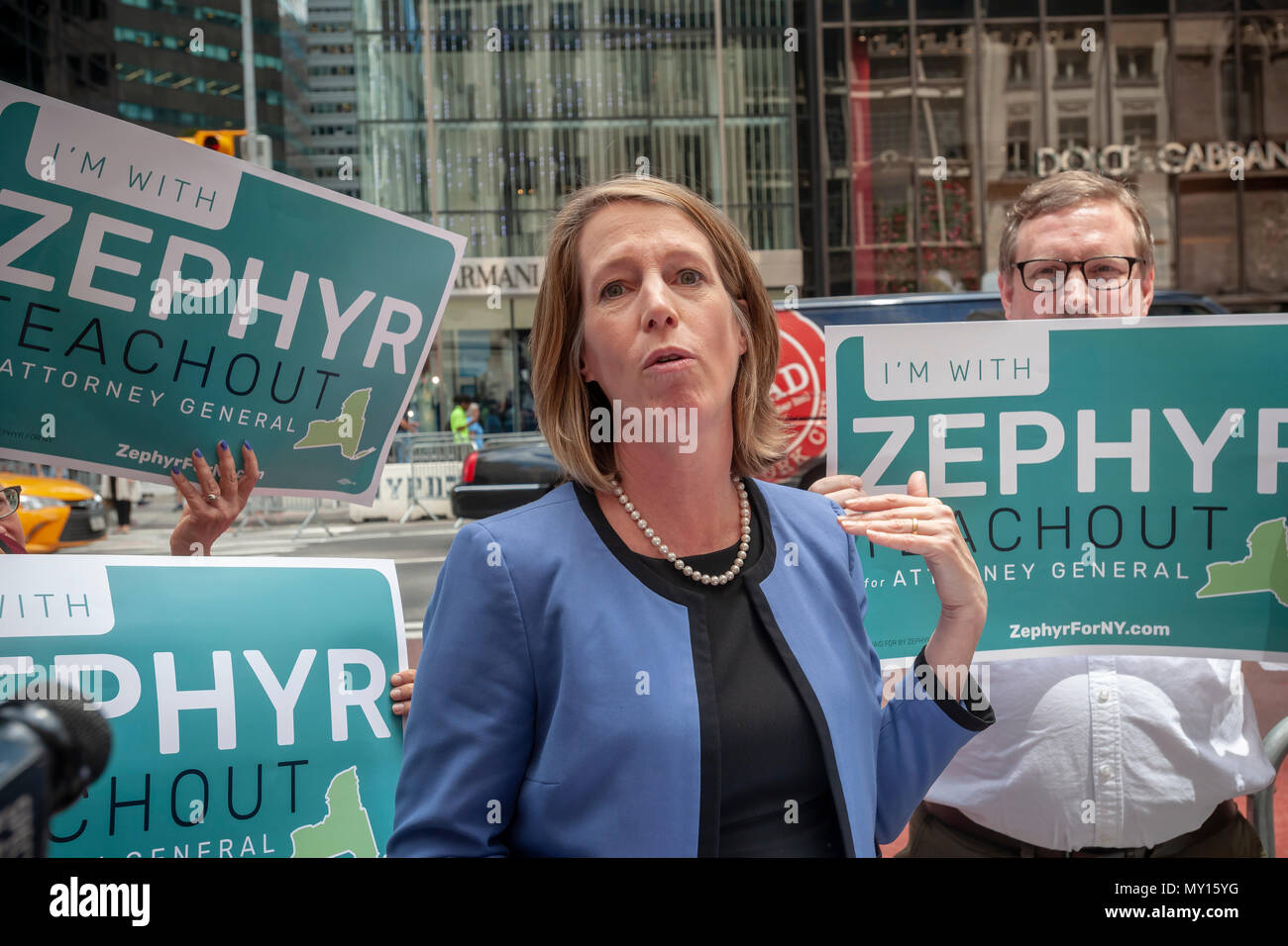 New York, USA. 5th June, 2018. Standing on Fifth avenue by Trump Tower Democratic NYS Zephyr Teachout joins supporters on Tuesday, June 5, 2018 as she announces that she is joining the field and running for New York State Attorney General, replacing disgraced Eric Schneiderman who resigned. Teachout made the announcement on the first day of petitioning, which she has to do to get on the ballot having not received 25% of the delegates' votes at the recent Democratic State Convention. (Â© Richard B. Levine) Credit: Richard Levine/Alamy Live News Stock Photo