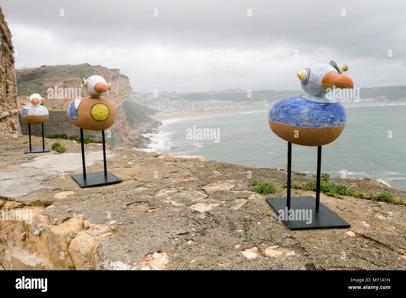 Art installation of seagulls place on the parapet of the Nazare lighthouse. Nazare, Portugal. Stock Photo