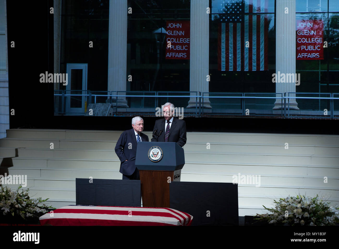 Jack Kessler and Louis Beck read the opening prayer during the Celebration of Life for Sen. John H. Glenn, Jr., at the Ohio State University, Columbus, Ohio, Dec. 17, 2016. Having flown 149 combat missions in World War II and the Korean War, Glenn became the first man to orbit the earth in 1962. After retiring from the space program, Glenn was elected to the U.S. Senate in 1974 to represent the state of Ohio. (U.S. Marine Corps photo by Lance Cpl. Daisha R. Sosa) Stock Photo