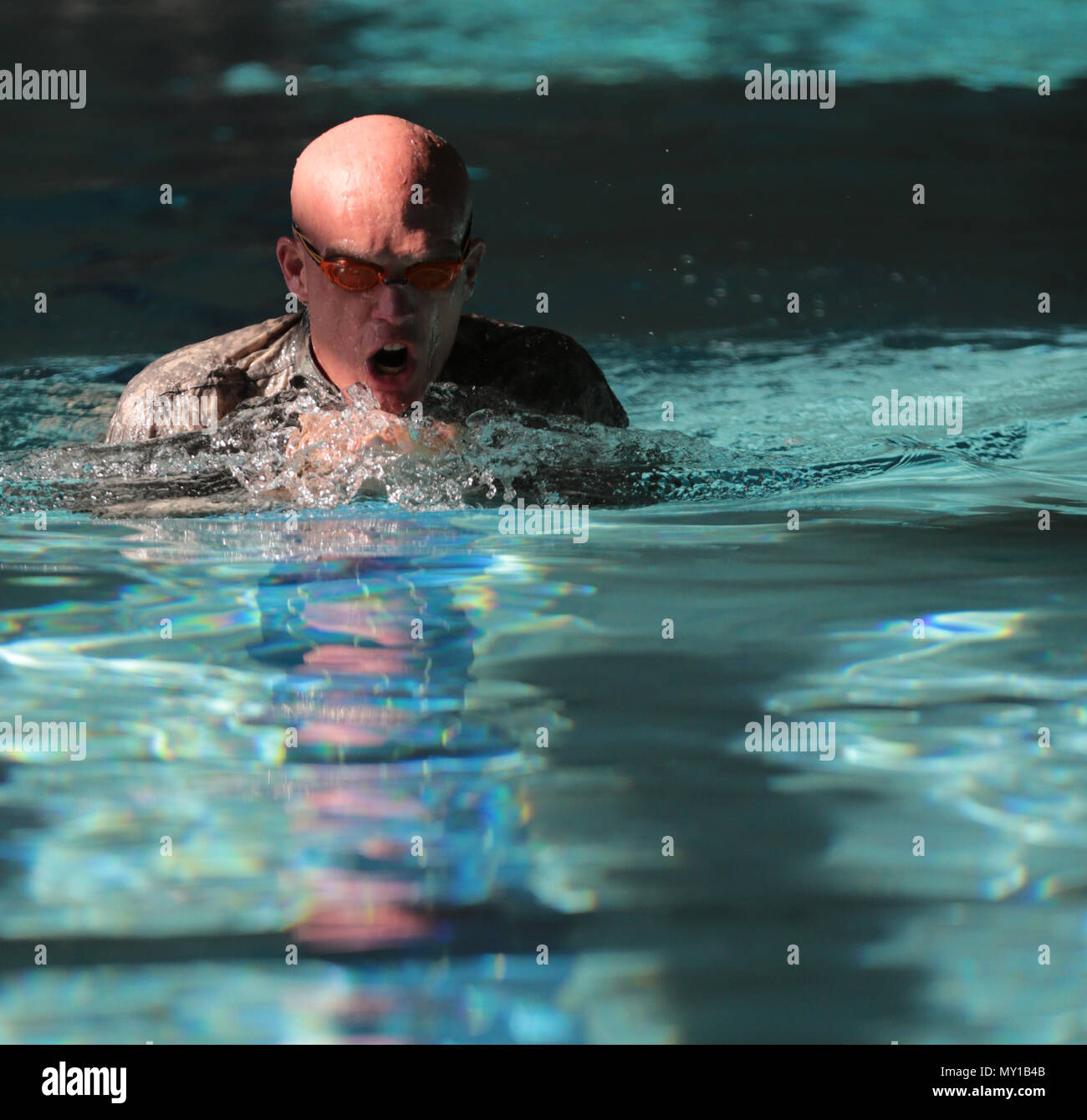 U.S. Army Maj. Paul Carlson competes in the swimming portion of the