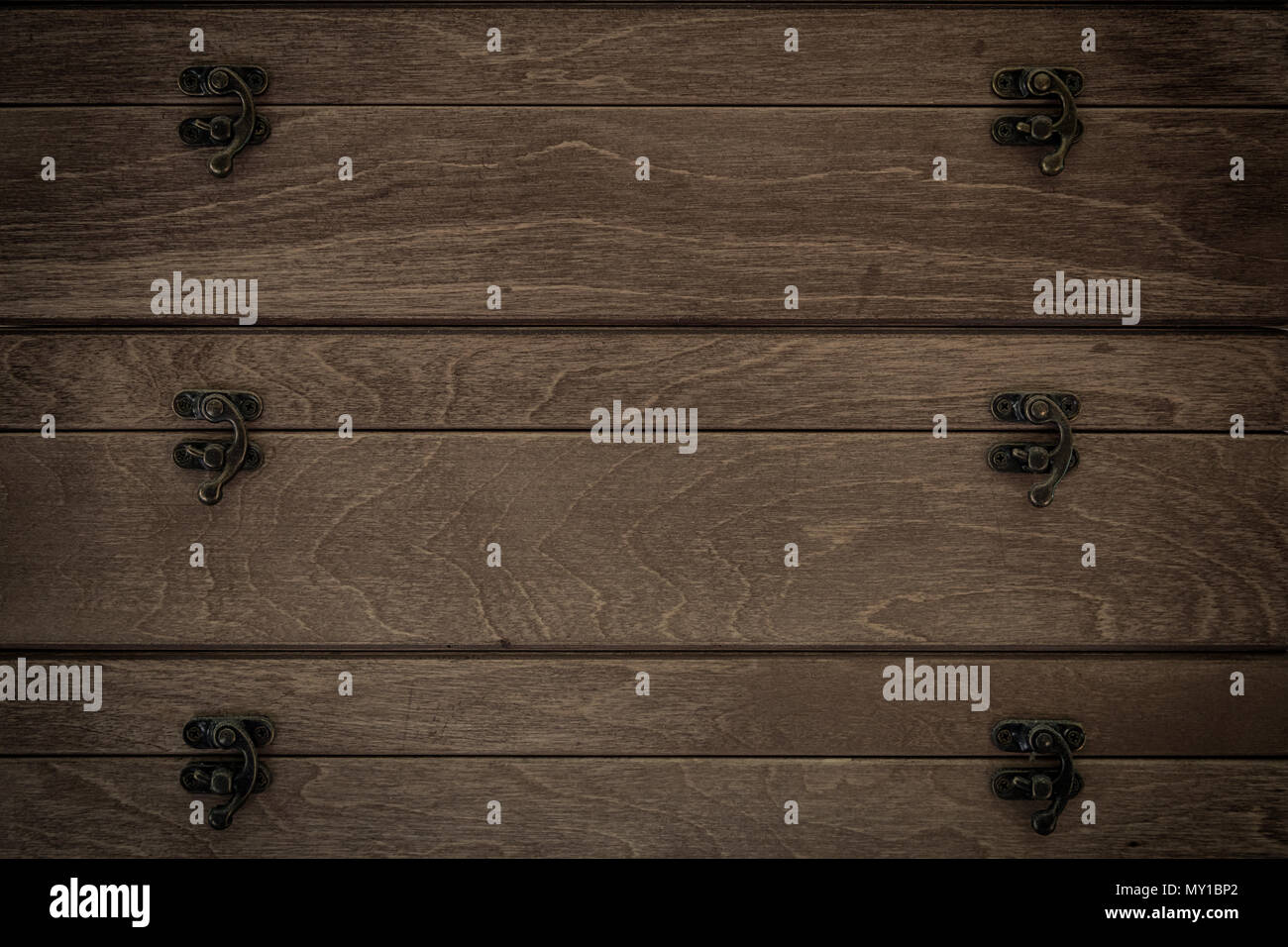 A Close Up Of A Dark Brown Chest Of Drawers Made From Real Wood