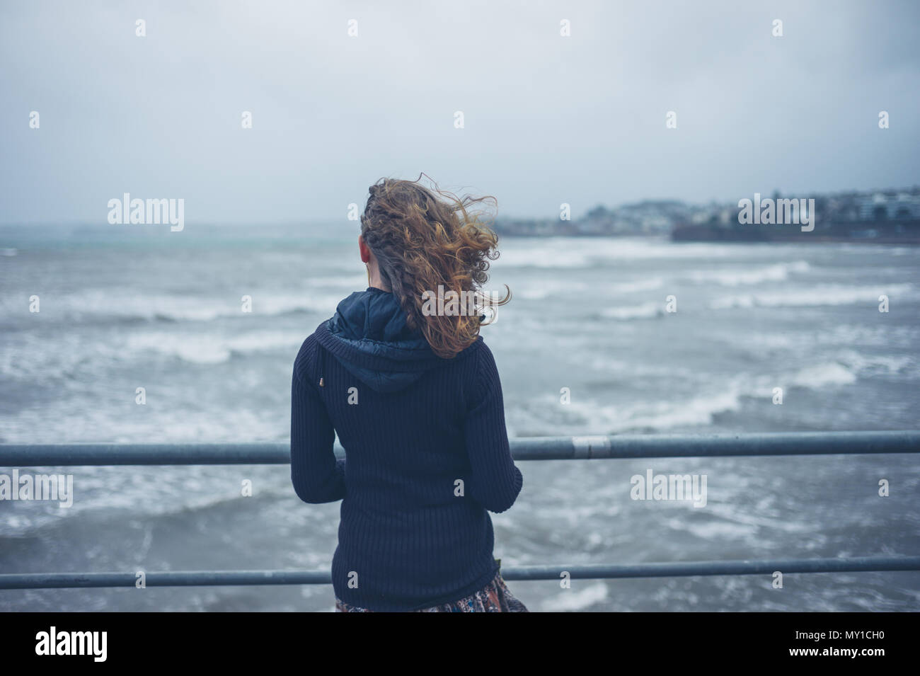 Woman and stormy sea hi-res stock photography and images - Alamy