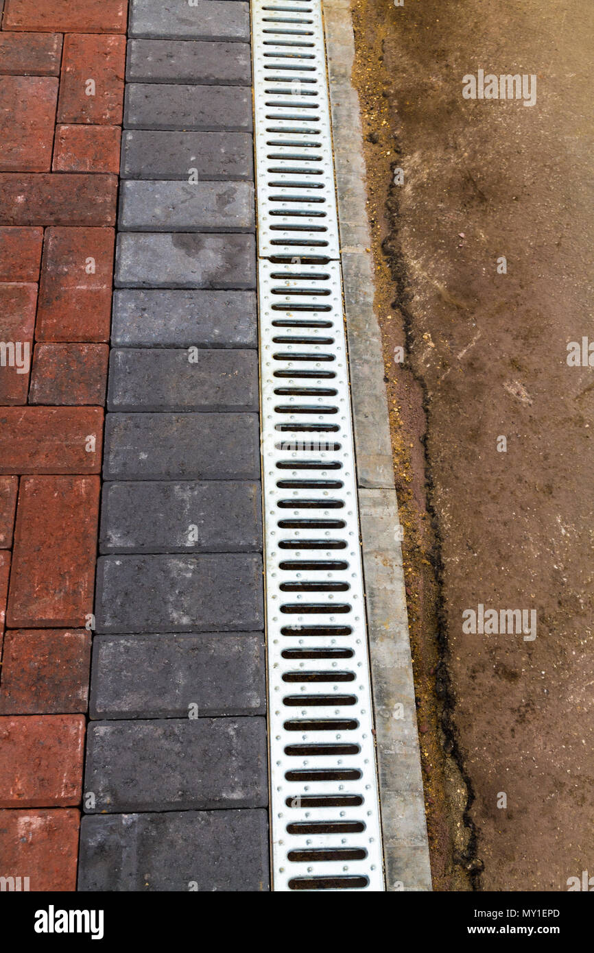 Drainage Channel with grid to drainage of driveway area Stock Photo Alamy